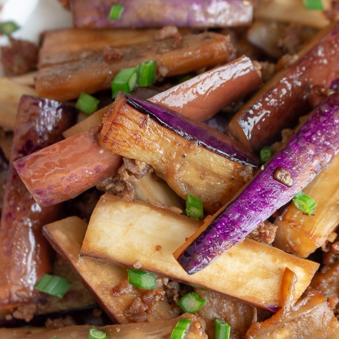 Long eggplant slices stir fried with pork really close up shot.