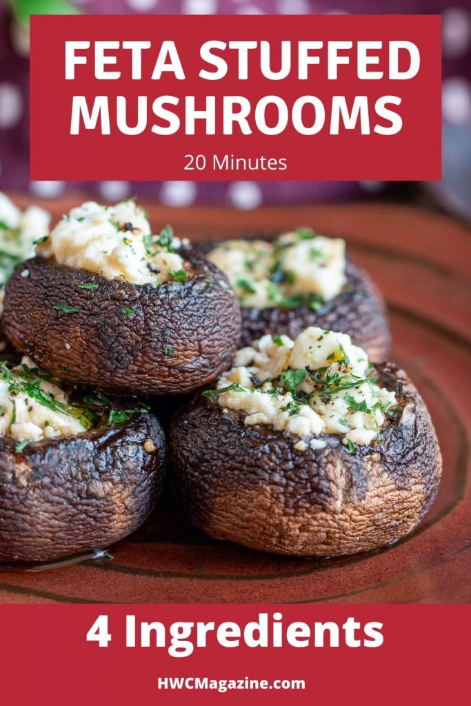 5 delicious feta stuffed portabella mushrooms on a handmade copper colored plate garnished with fresh parsley.