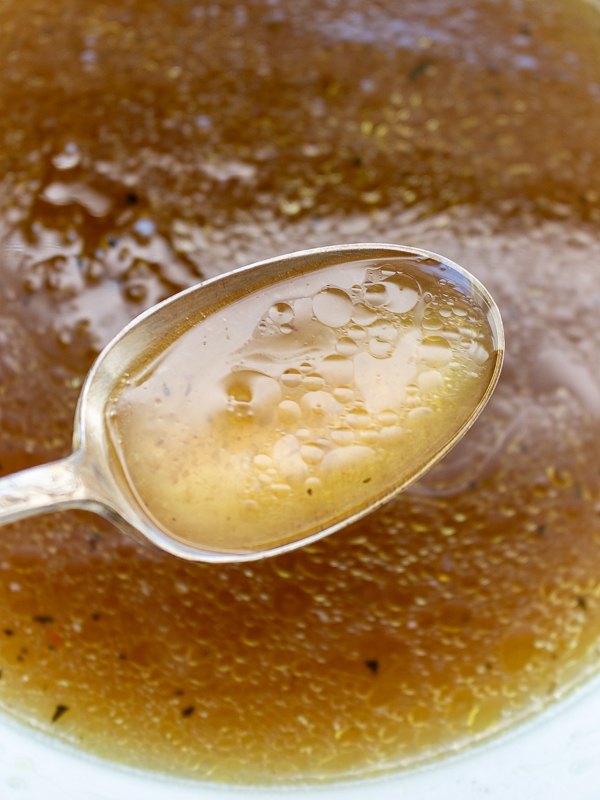 Spoonful of delicious Chicken bone broth drippings from the roasted chicken. 