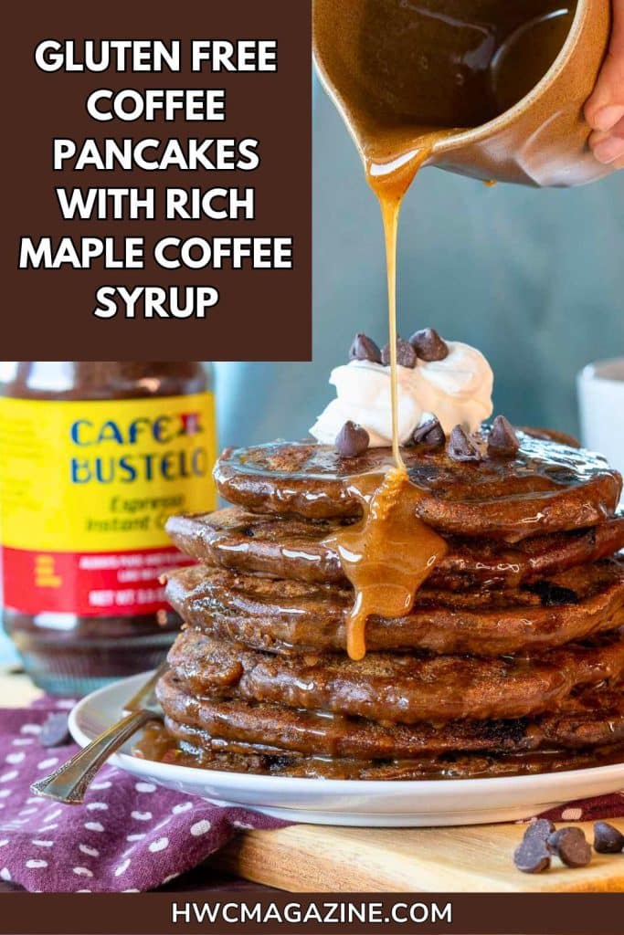 Syrup getting poured over pancakes with espresso coffee and chocolate chips.