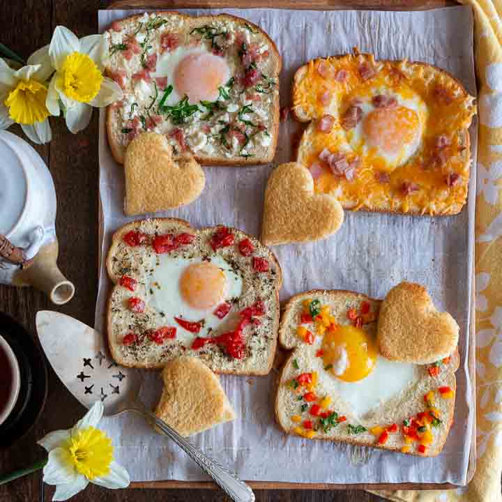 4 delicious egg in the hole breakfast options on a platter.