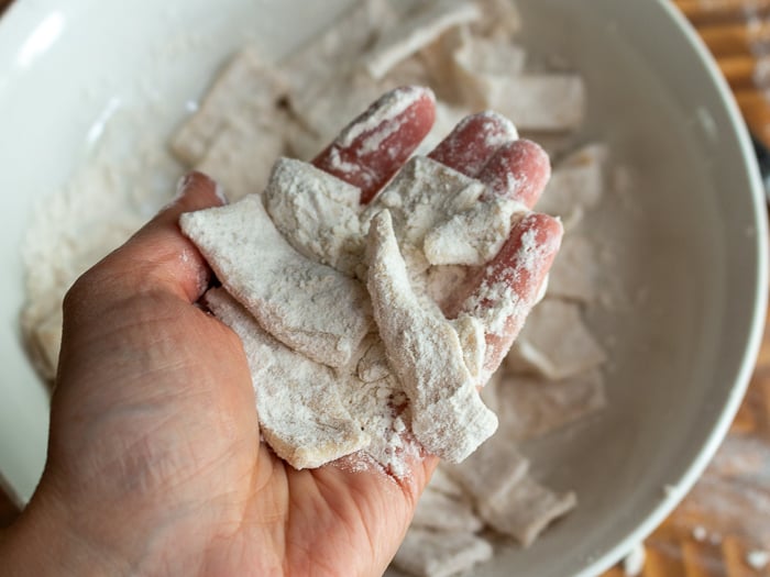 Handful of cut slider noodles with lots of flour so they don't stick together. 