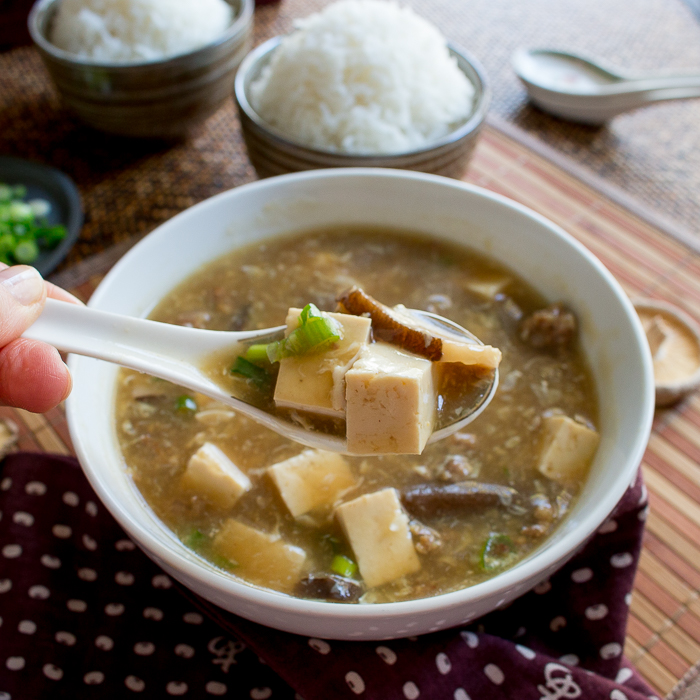 Steaming hot soup showing the deep rich broth with the egg drop. 