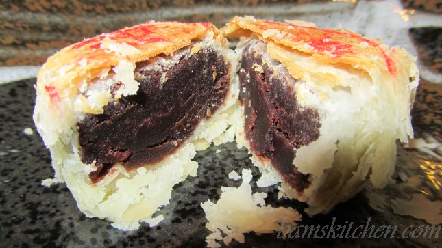 suzhou moon cake cut in half to show the red bean paste.