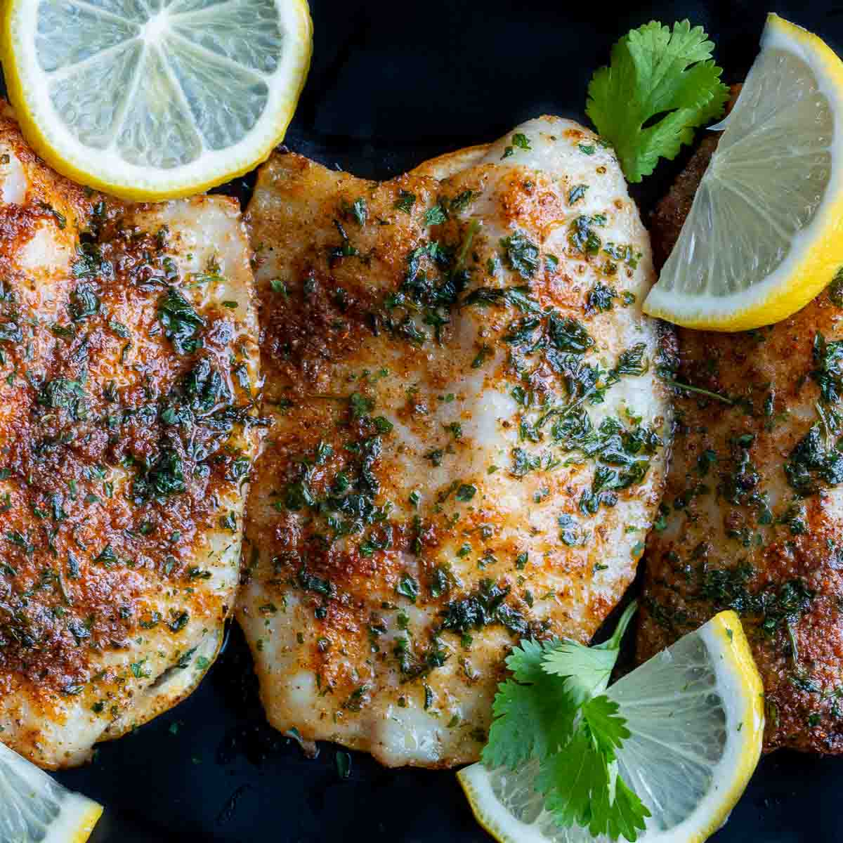 Lemon garlic butter sauce just poured over the fish. 