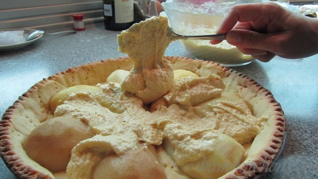 Placing the Almond cream inside the tart.