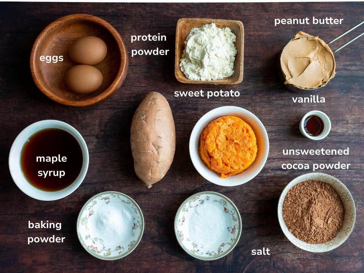 Ingredients to make sweet potato brownies laid out on a wooden board. 