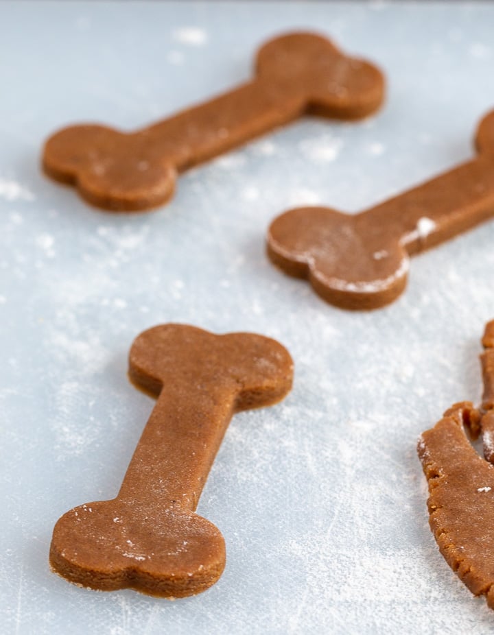 Dog bone shaped gingerbread cookies ready for the oven.