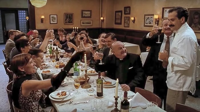 Last scene of the movie big night at the big long table and toast of wine