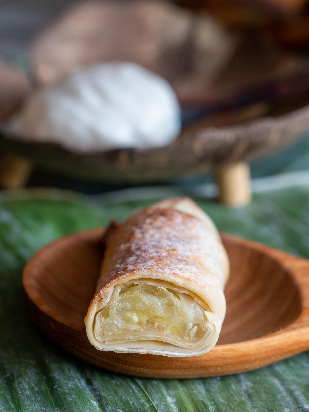 Banana roll cut in half to show the creamy banana filling.