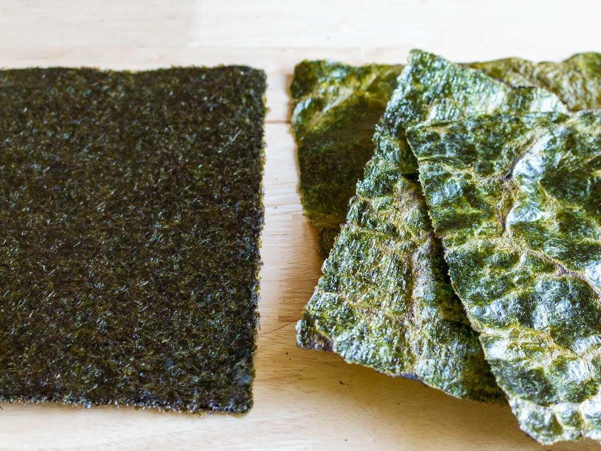 showing the difference of the seaweed sheets before and after roasted turning from dark green to bright green.