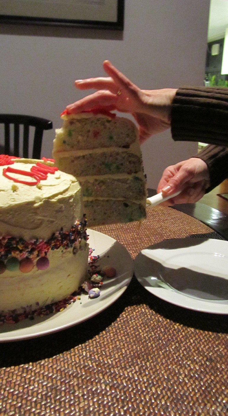 Four Tiered confetti cake with buttercream frosting