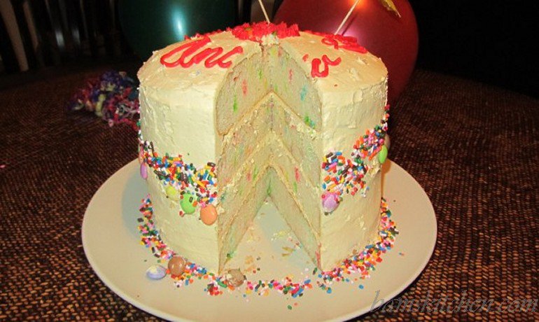 Four Tiered confetti cake with buttercream frosting