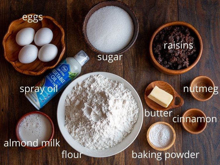 Ingredients to make the cakes set out on a wooden board.