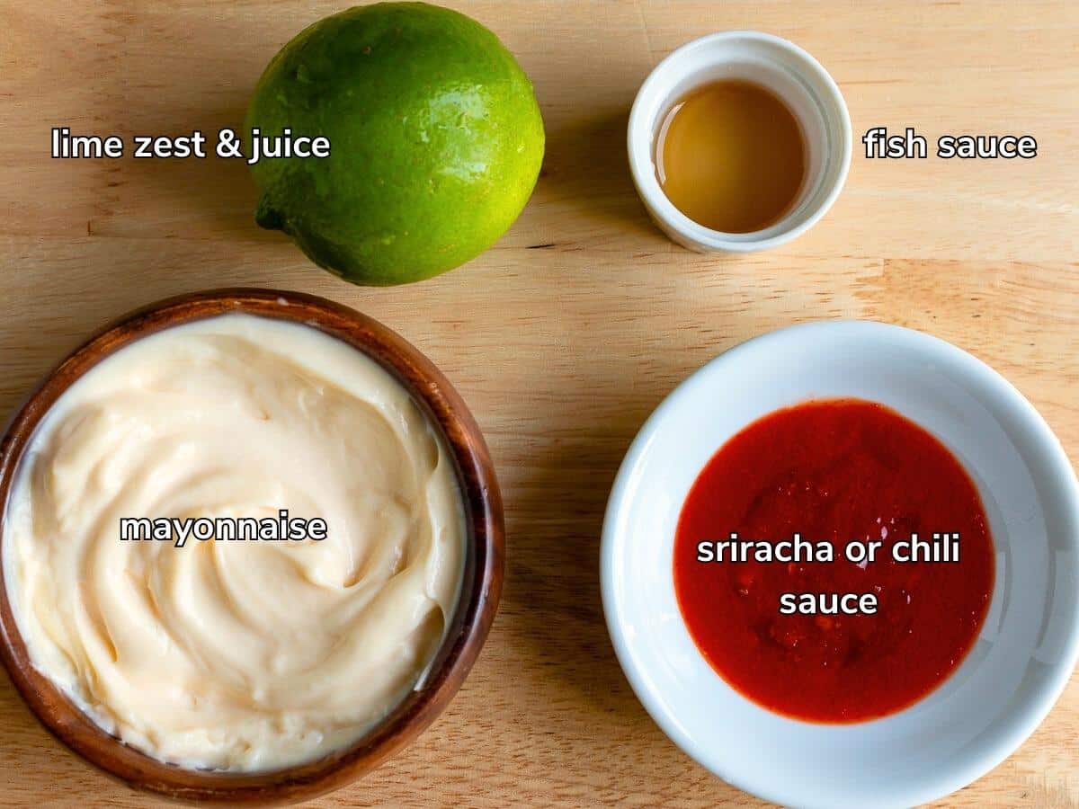 Ingredients to make lime chili mayo laid out on wooden board.