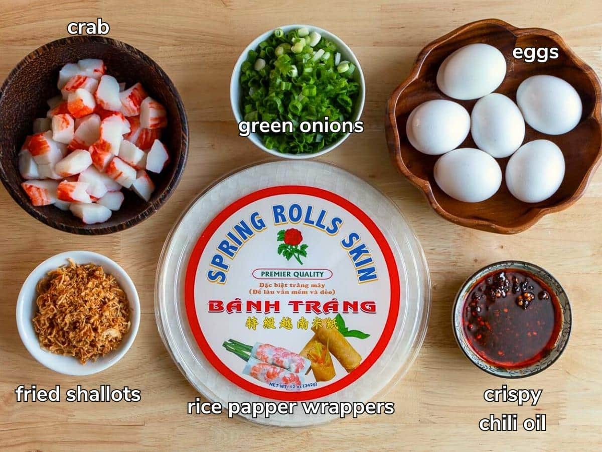 Main ingredients to make a Vietnamese pizza on a wooden board.