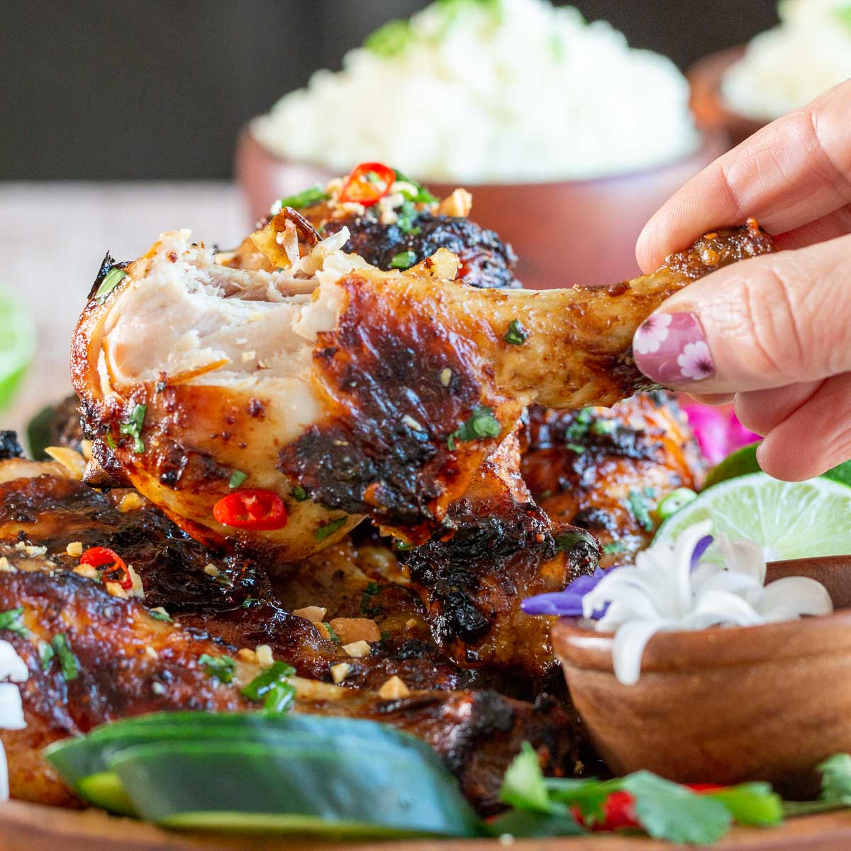 A bite out of a juicy but crispy air fryer chicken drumstick.