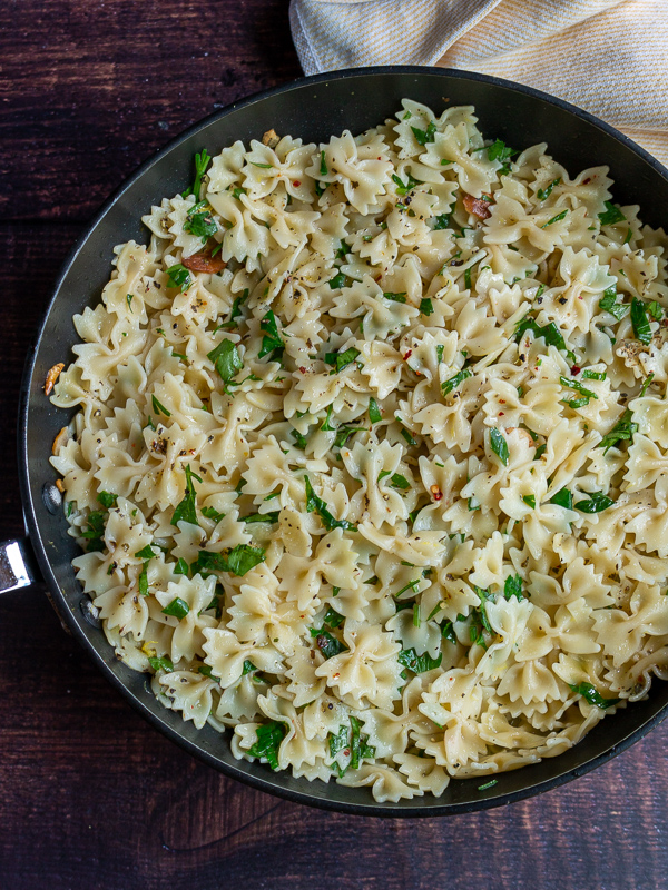 Bow Tie pasta noodles just freshly tossed with pasta water and parsley. 