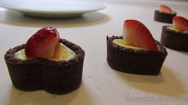 Chocolate drizzled berry bites of cheesecake heaven