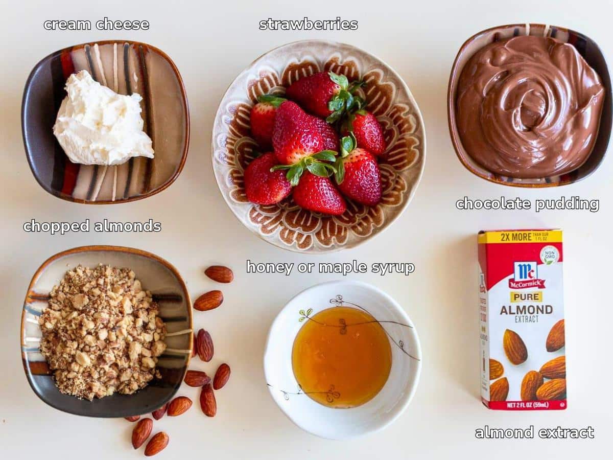 Ingredients to make the chocolate cheesecake bites on a beige table. 