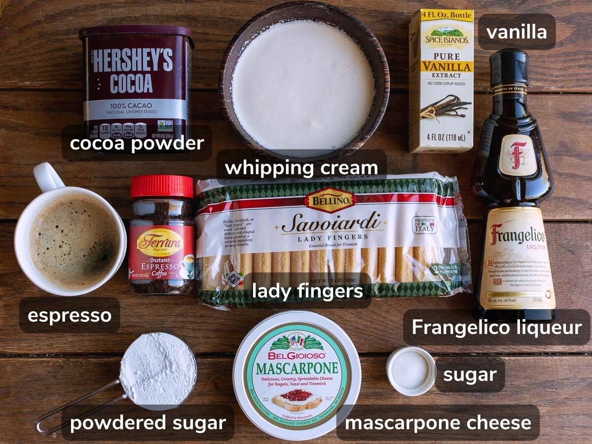 Ingredients to make egg free tiramisu  laid out on a wooden table.