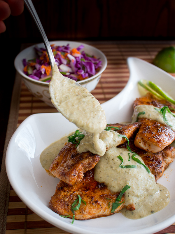 Tomatillo roasted salsa drizzling over the grilled chicken breasts