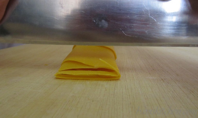 cutting Tagliatelle with a knife.