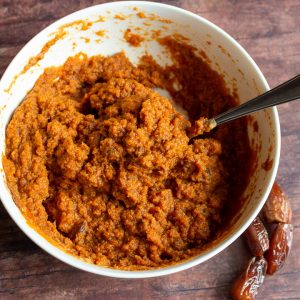 Pumpkin Puree and spices mixed in white bowl.