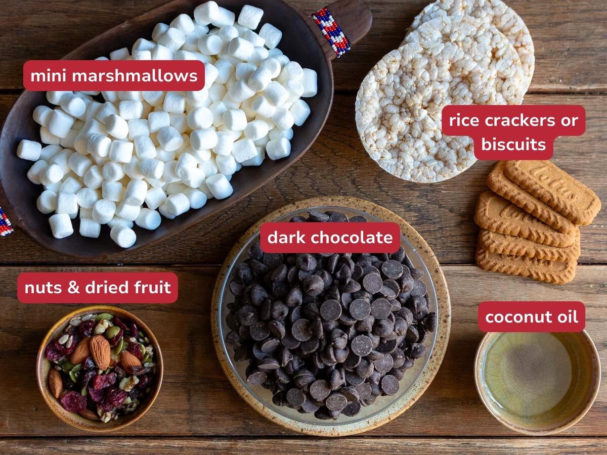 Ingredients to make rocky road bars on a wooden table.