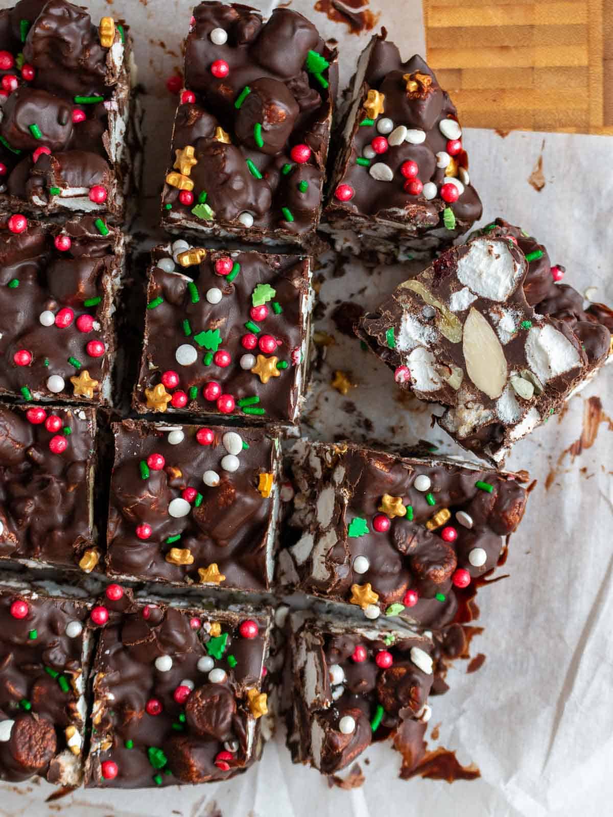 Rocky road bars sliced with red, green and gold holiday sprinkles. 