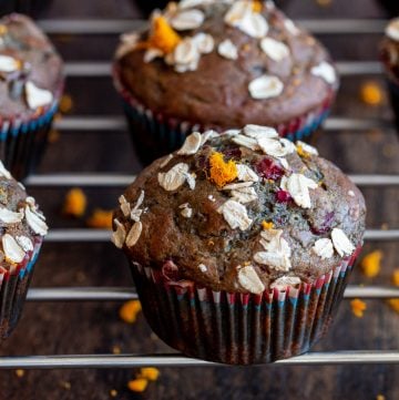 Baked Cranberry Sauce Muffins cooling on a wire rack.