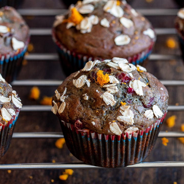 Cranberry Sauce muffins cooling on a wire rack.
