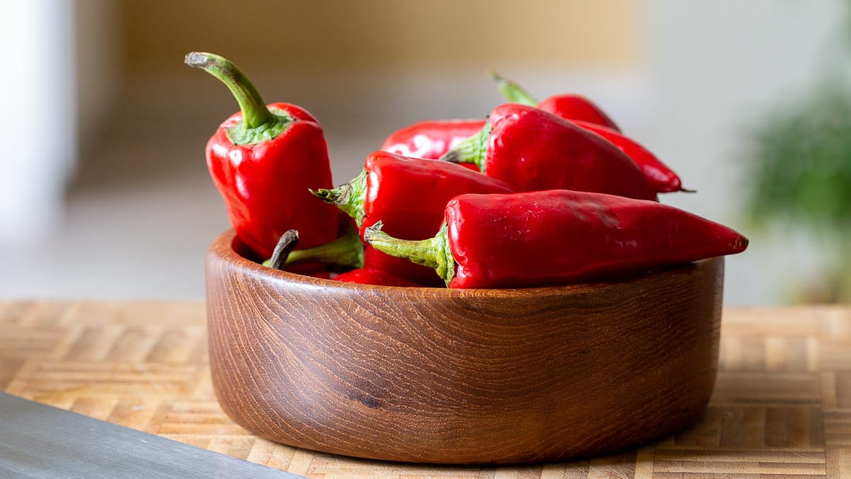 Fresno chili peppers in a wooden bowl.