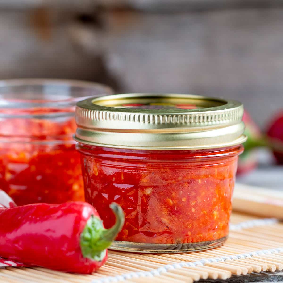 Asian chili garlic sauced in glass jars.