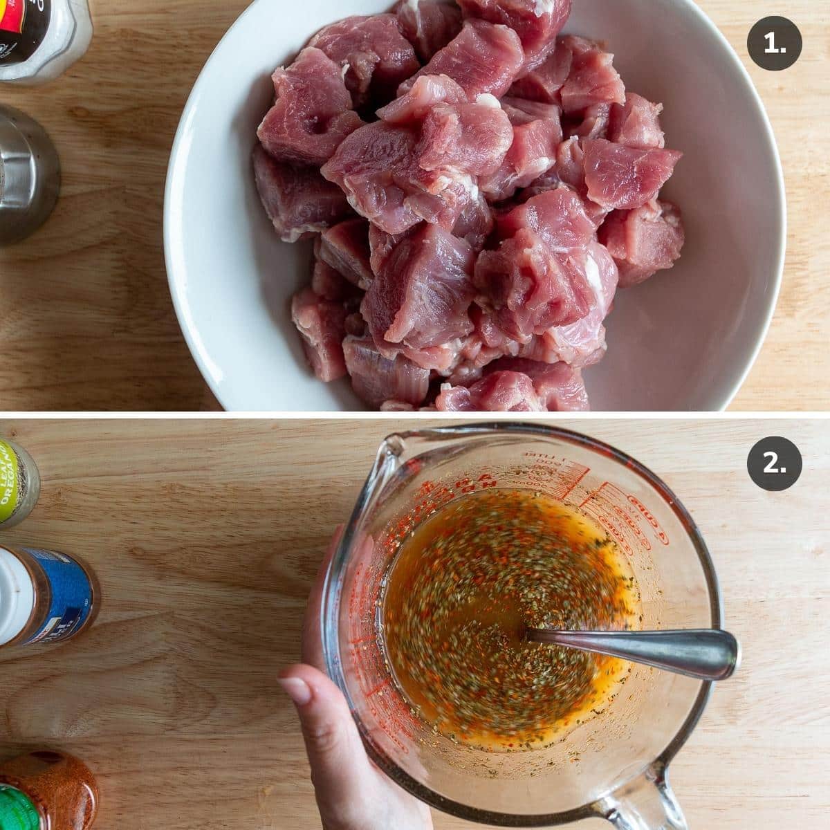 Pork chopped into cubes and citrus sauce in a measuring cup.