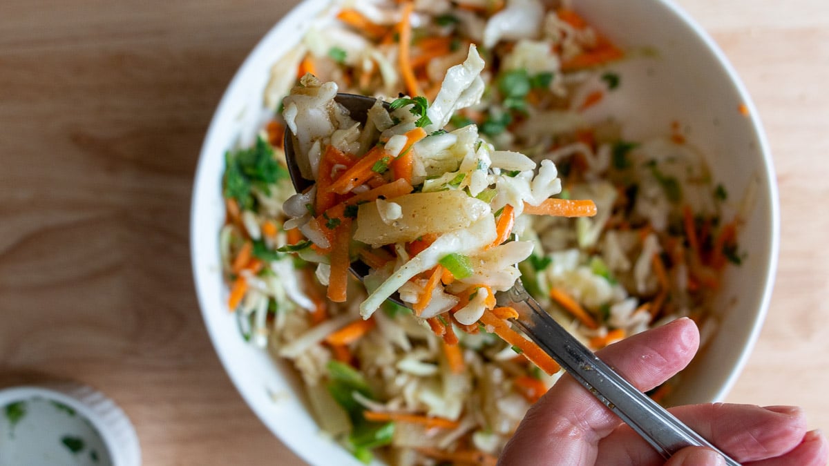 Pineapple slaw on a spoon.