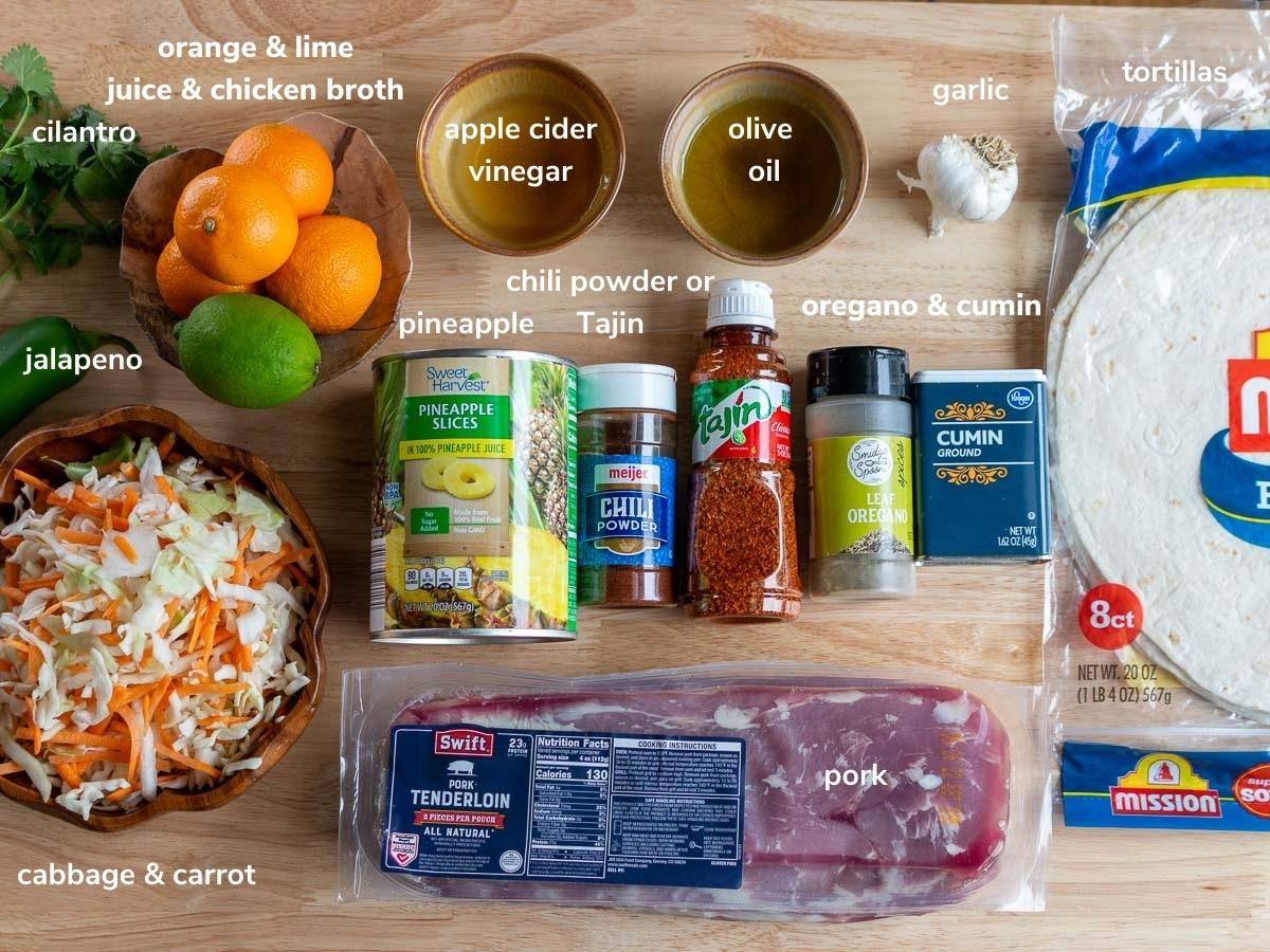 Ingredients to make pork carnitas burritos and pineapple slaw.
