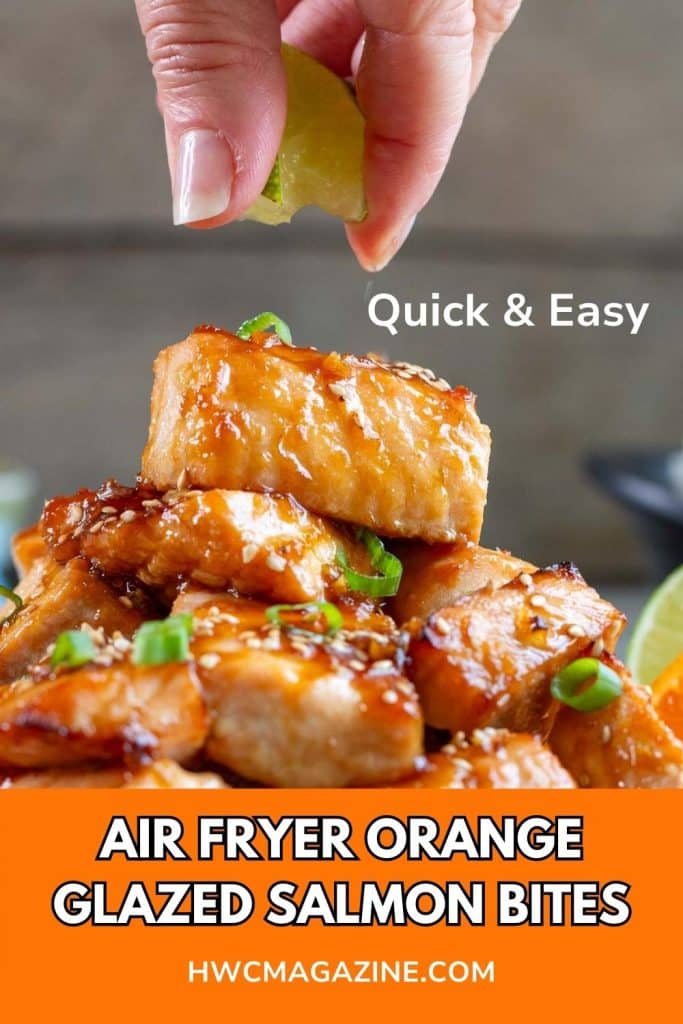 Orange glazed air fryer salmon bites getting a little squeeze of fresh lime juice on top.