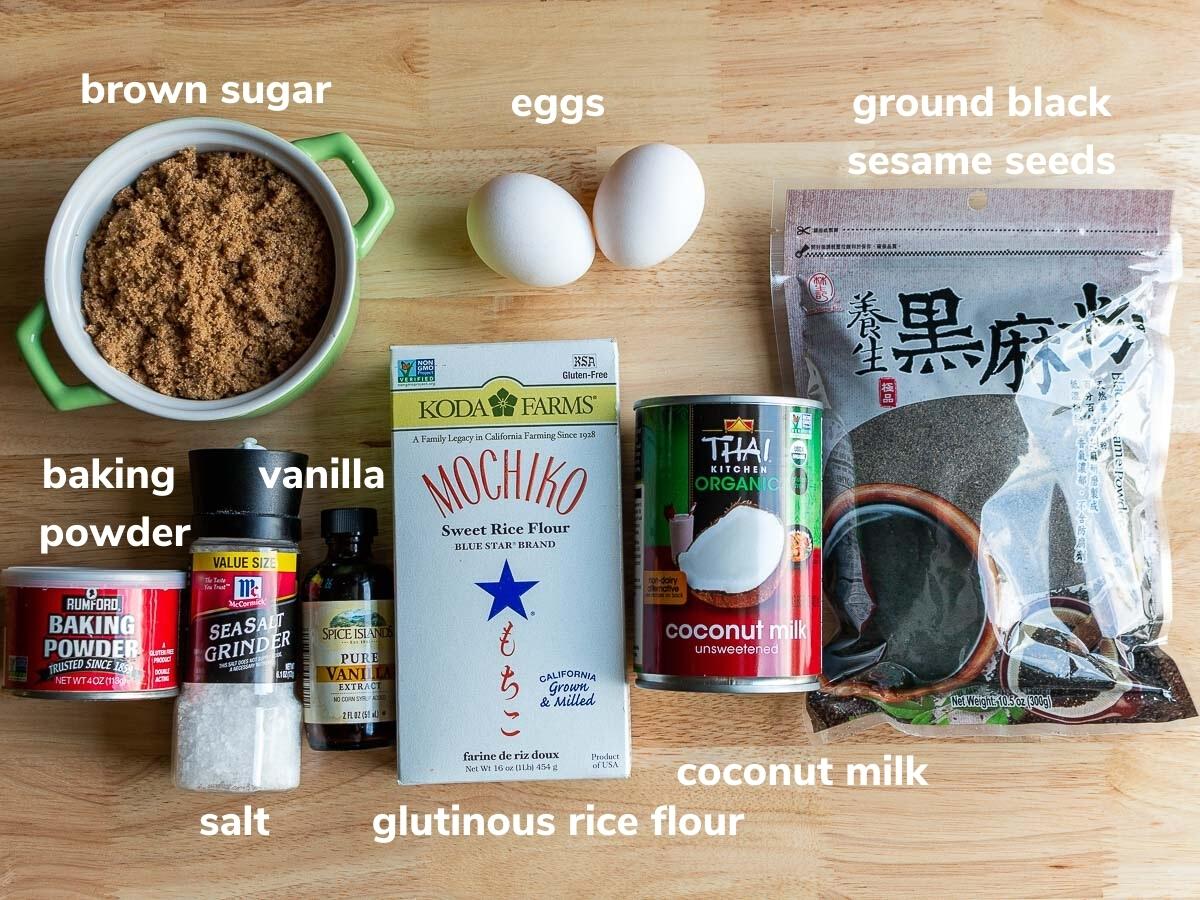 Ingredients laid out on a wooden board to make homemade baked mochi donuts.