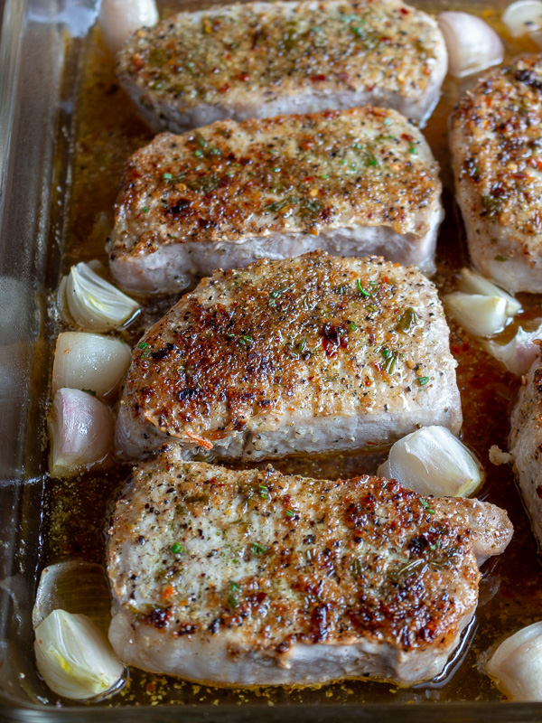 Tray of boneless pork chops just out of the oven.