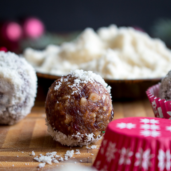 close up of the holiday bliss ball dusted with almond meal. 