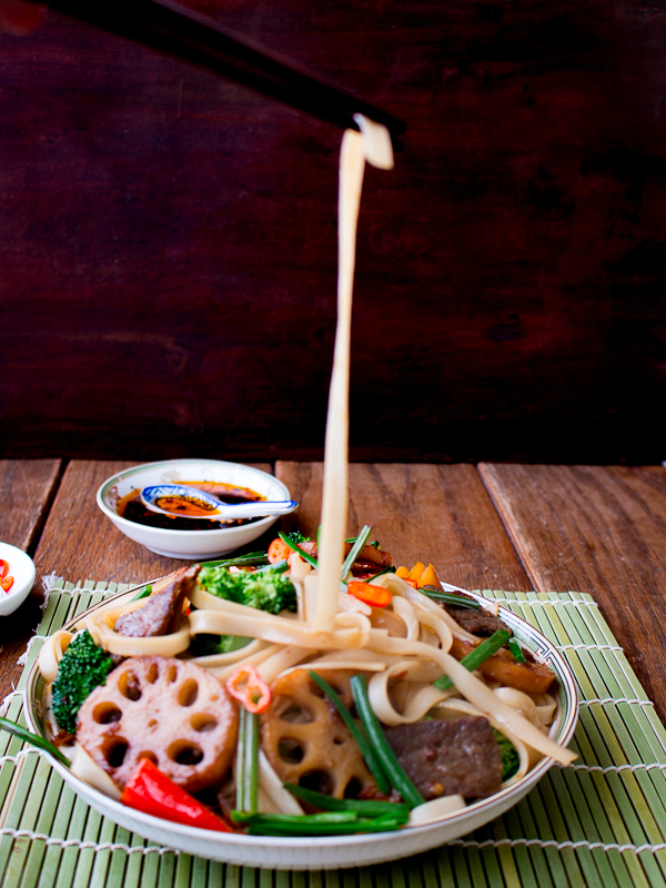 Chop sticks gathering the noodles.