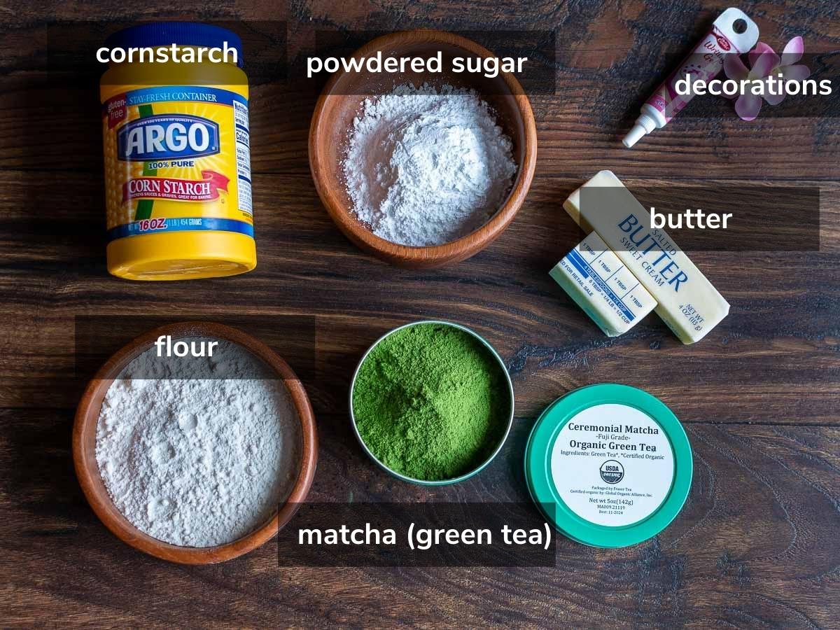 Ingredients to make shortbread cookies on a wooden table.
