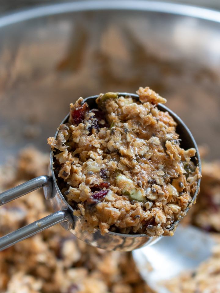 ¼ cup scoop filled with cranberry oatmeal cookie dough to place on the baking tray.