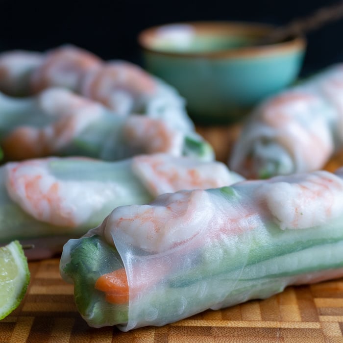 Close up shot of summer rolls showing the shrimp and vegetables through the delicate rice paper wrapper. 