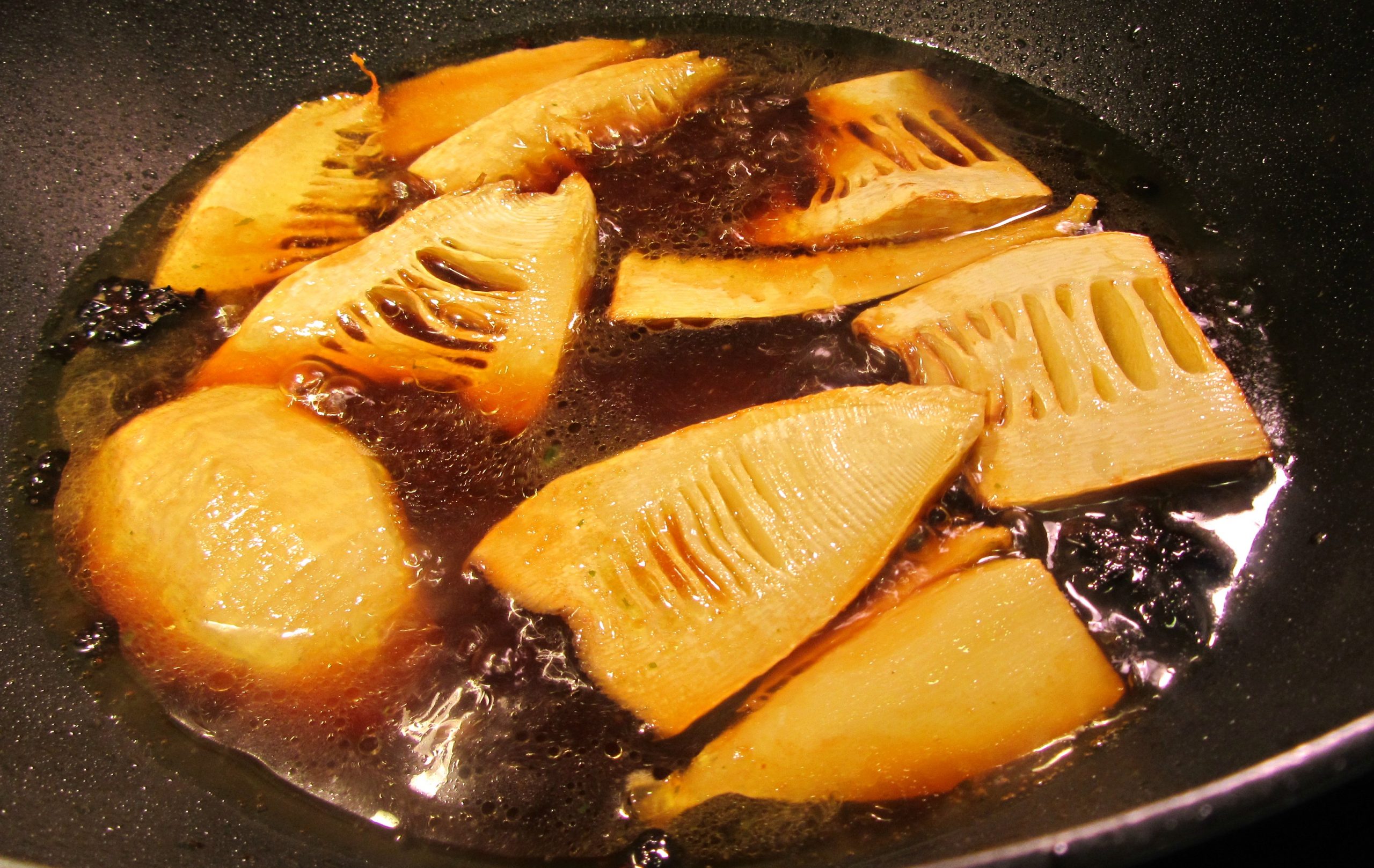 Bamboo shoots braising in broth.