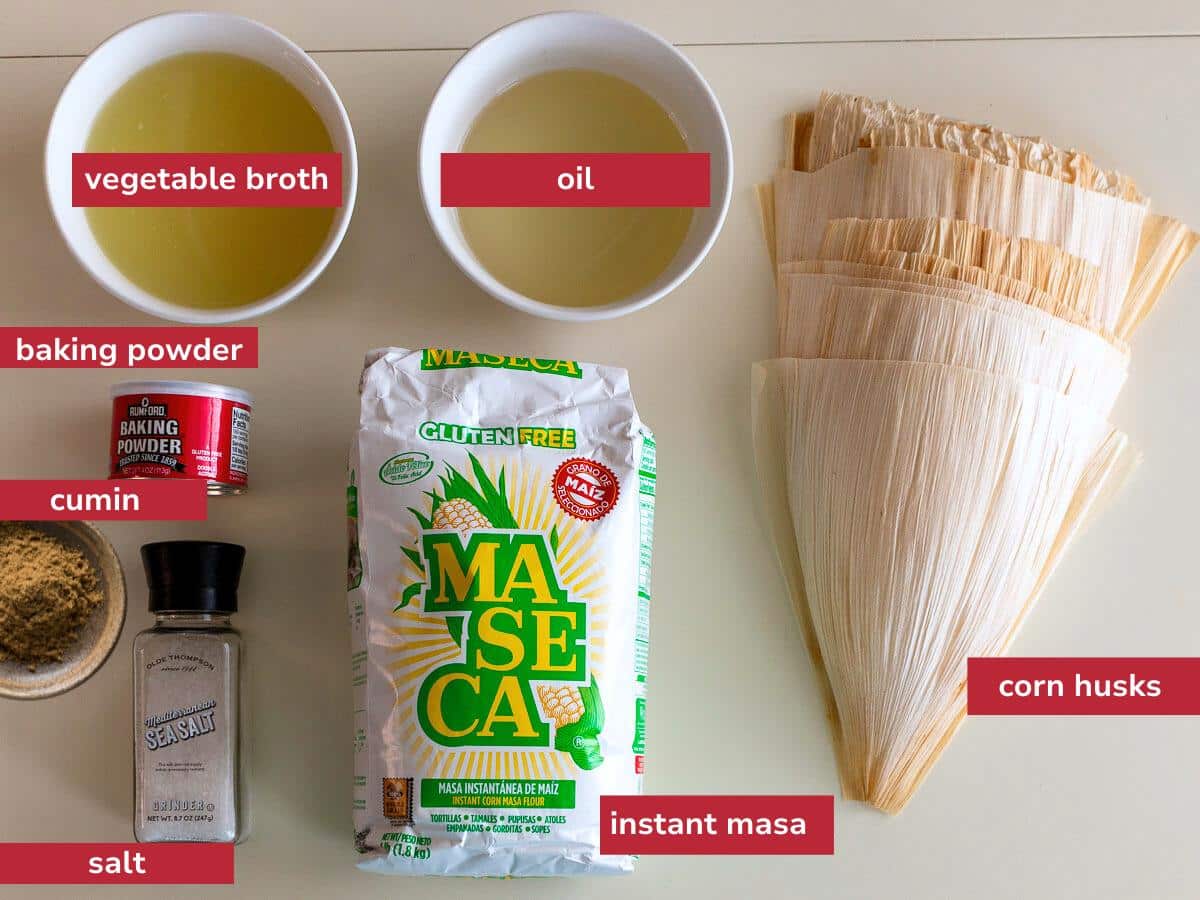 Ingredients to make gluten free masa for tamales laid on a beige table.