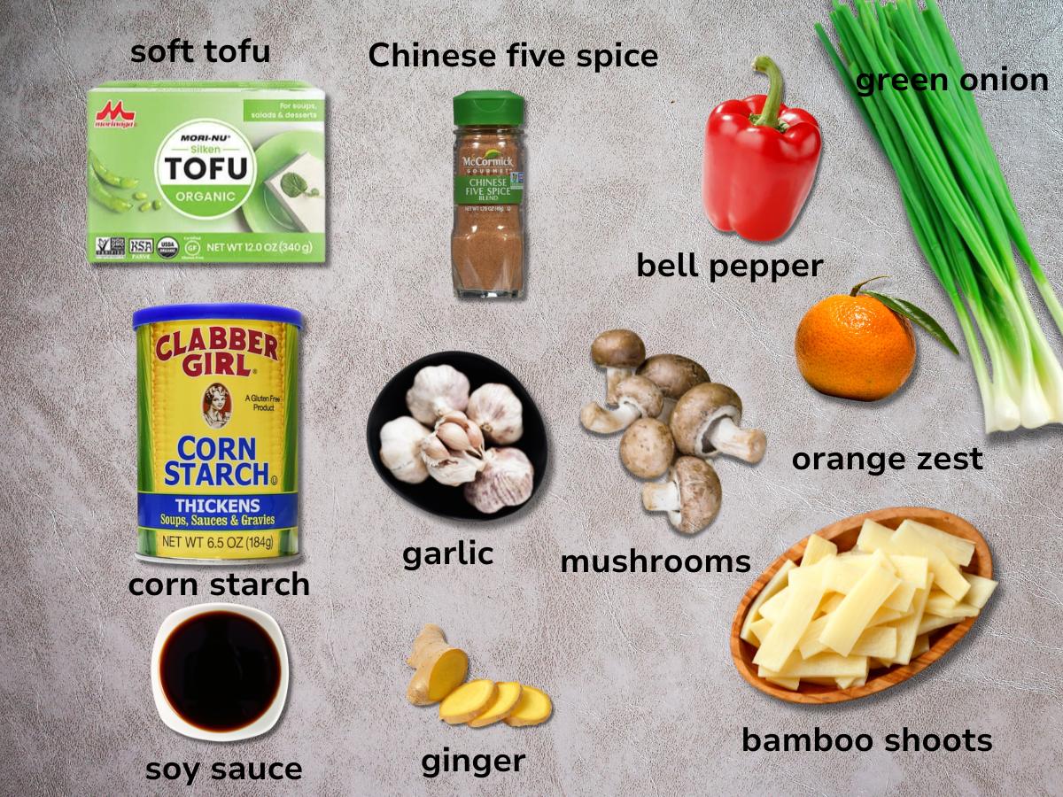 Ingredients to make savory pancakes on a grey table. 