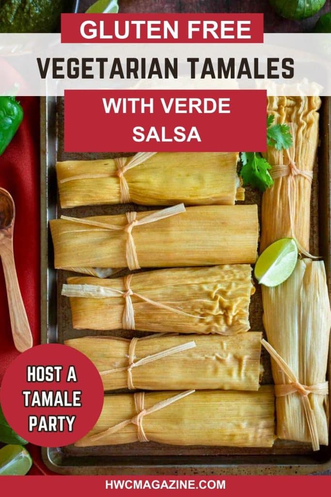 Freshly steamed tamales on a dark plate with extra tomatillo salsa on the side.