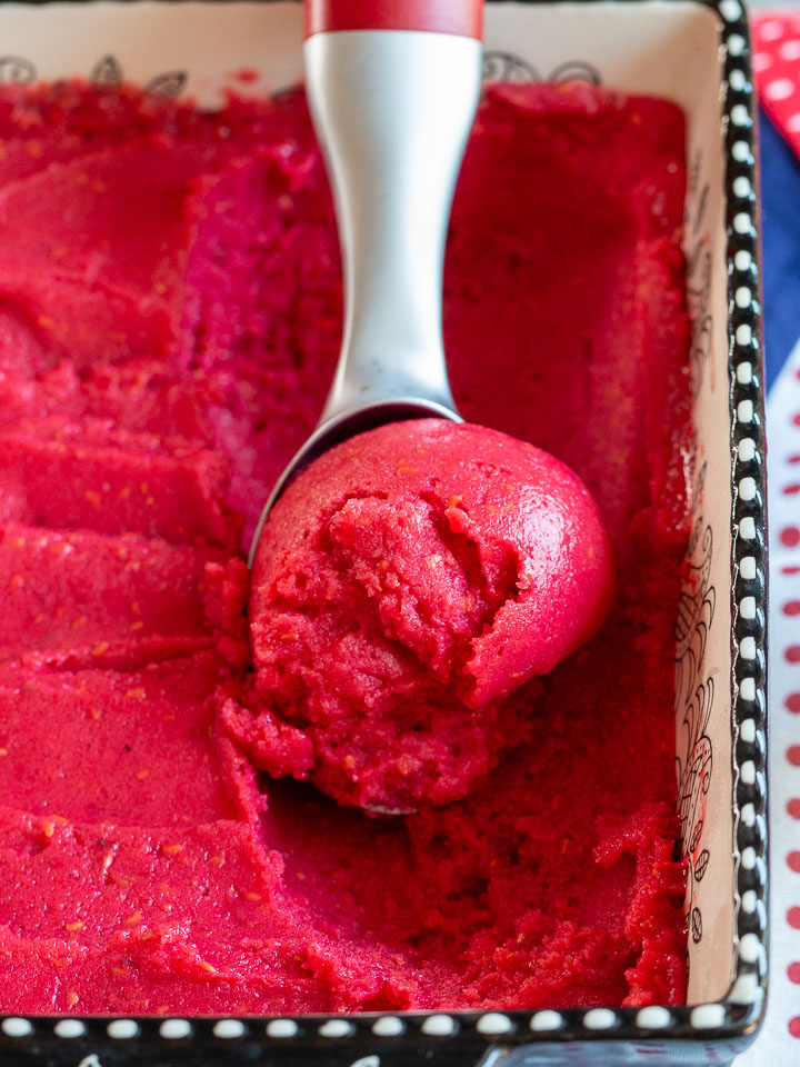 Raspberry sorbet scooped and ready to be served.